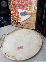 ceramic stone on metal rack; retail box behind