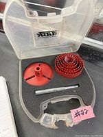 Open TASK case with nested red hole saw blades and mandrel