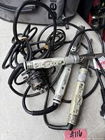 Overview of three hair irons and cords