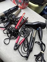 Group view of all corded hair tools piled together
