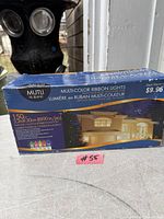 Front view of boxed multi-colour ribbon lights set