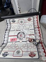 Overall view of roll-up NHL game board with tokens