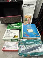 Group view of tote, file folders, envelopes and packaging