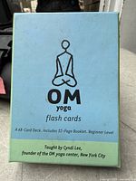 Front of sealed OM Yoga flash cards box
