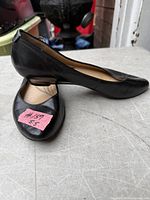 Side view of both shoes showing exterior condition and heel