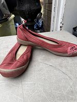 Top and side view of both shoes showing color, style and wear