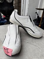 full view of both shoes showing upper design and condition