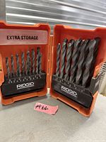 Open Ridgid case showing full assortment of drill bits in graduated sizes