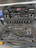 Open tool case showing sockets, ratchet, extensions, bits and accessories