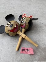 Pair of Mickey and Minnie maracas showing full design and handles