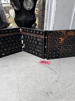 Keyboard partially unfolded showing QWERTY keys and macro panel