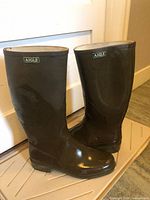 Full side view of both olive rubber boots