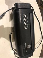 Top view of Concept Solutions shredder showing overall design and power cord