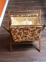 Overall view of wooden magazine rack standing open