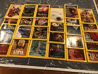 Twenty National Geographic magazines laid out in four rows of five on a table
