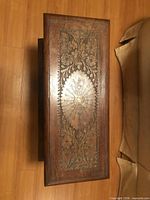 Top view showing carved floral design and finish