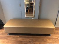 Front view of upholstered bench ottoman