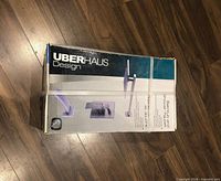 Sealed box marked UberHaus Design showing product image of freestanding tub filler faucet