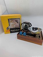 Full set showing camera, flashholder, two bulbs, and original box