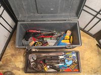 Open toolbox showing interior tray with various tools
