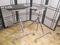 Both Ridgid flip-top work supports standing side by side, legs unfolded