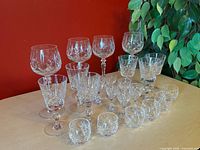 Full set of crystal stemware and glassware displayed on table