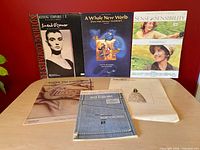 All six pieces displayed front covers