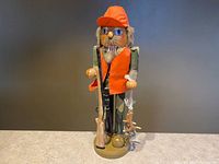 Full view of Deer Hunter nutcracker on base