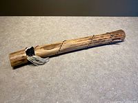 Full view of wooden cactus rainstick showing overall length and finish