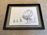 Full view of framed sketch showing black frame and placement of artwork