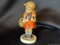 Full front view of the figurine on base