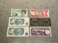 All six banknotes laid out front side visible