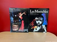 Front covers of both sheet music items side by side