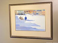 Framed watercolor on wall showing full artwork and frame