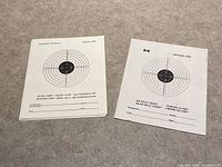 Stack of two styles of official size paper targets