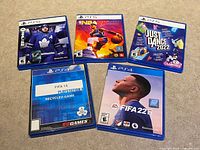 Front view of the five PlayStation game cases