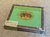 Top view showing green lid, crest and border