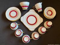 Full 21-piece tea set arranged on dark surface