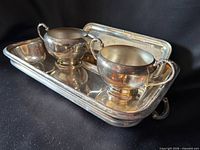 Tray holding creamer and sugar bowl, overview of three pieces