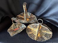 All three silver plated pierced serving pieces grouped