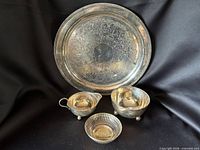 Front view showing all four silver-plated pieces together