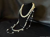 All three necklaces displayed on bust