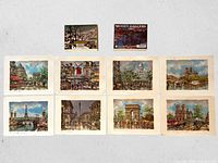 Group shot of eight prints and two sealed card deck boxes