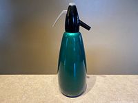 Full view of assembled emerald green soda siphon