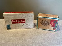 Both cigar boxes front view on surface