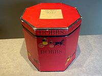 Full view of octagonal red Dobbs hat box