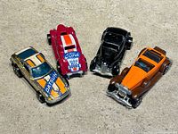 Top view of all four cars showing liveries and colors