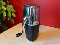 Front view of chrome and black Rival Ice-O-Mat ice crusher