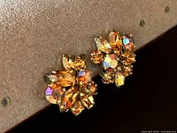 Front view of both earrings showing crystal colors and cluster design