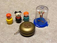 Group shot of yo-yo, Goofy pop-up, three wooden figures